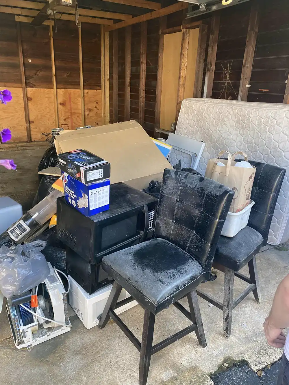 Commercial junk removal services clearing out a room.